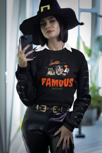 halloween themed sweatshirt mockup of a woman with a witch hat taking a selfie m35497